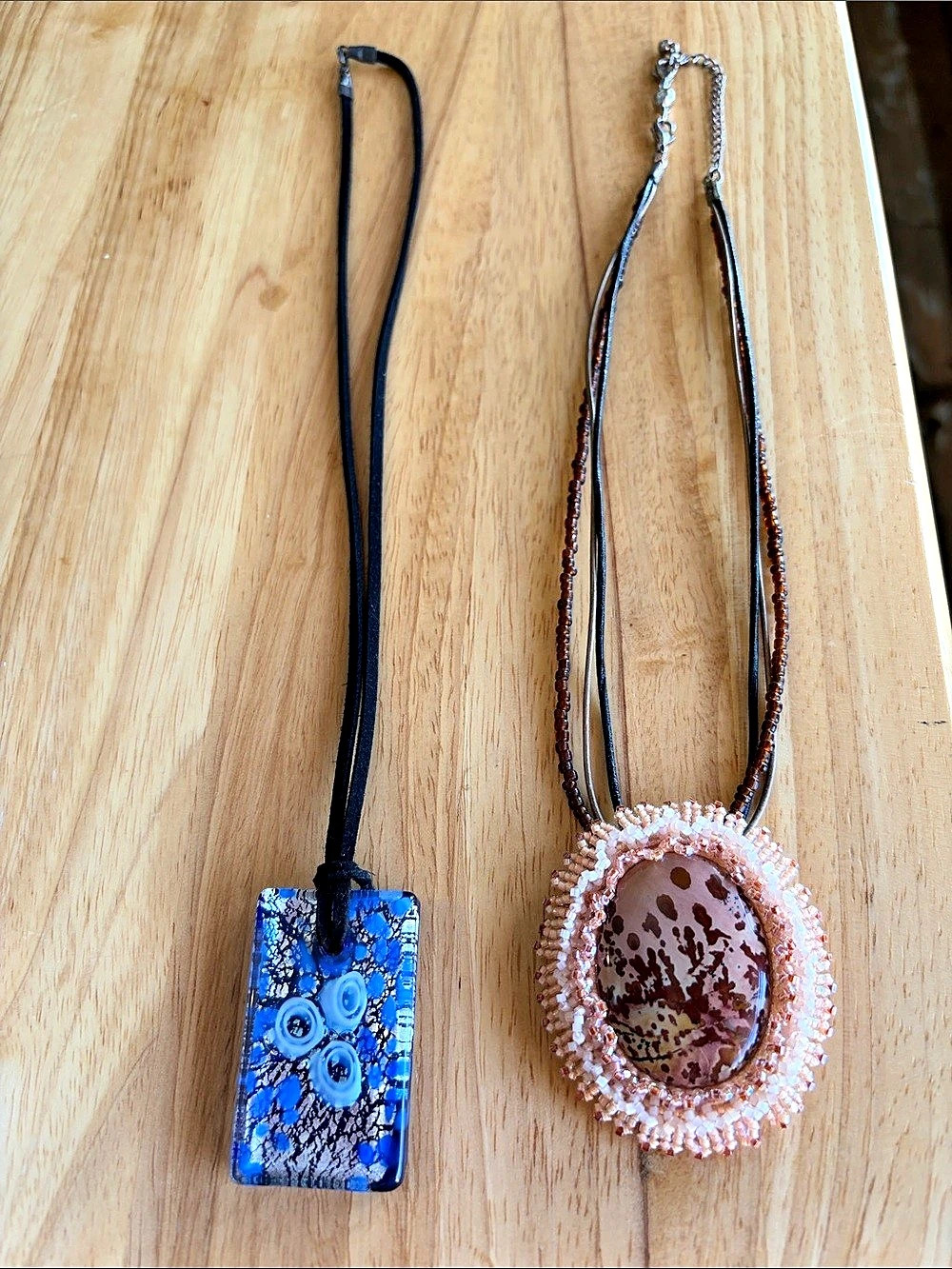 Two Boho style pendant necklaces on leather cord